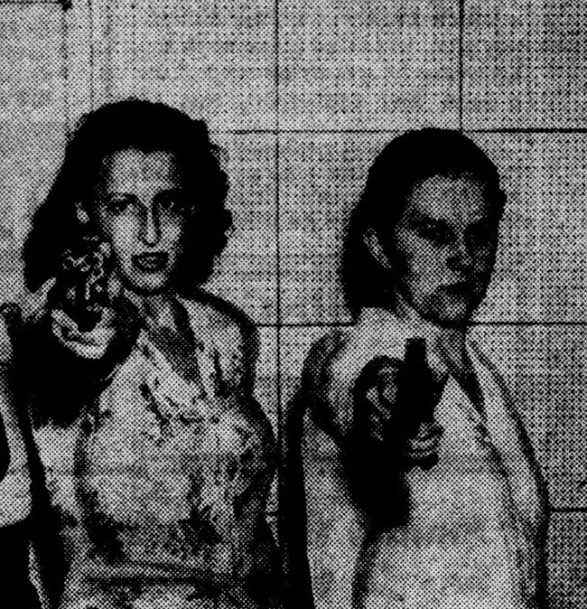 Newspaper photo of Grace Judy and Veda Black aiming guns towards the camera.