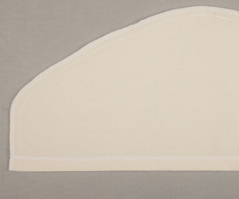 Stitched muslin slipcover turned inside out.