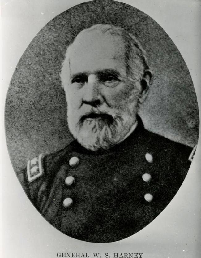 Black and white photograph of a man in a military uniform. Below him is text reading "General W.S. Harney"