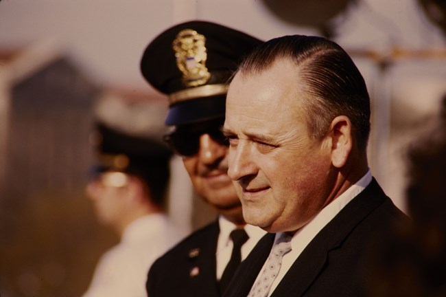 George Hartzog standing next to Grant Wright in his police uniform
