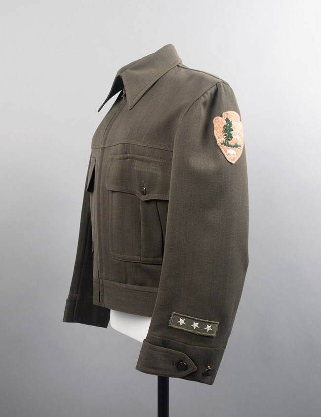 Sallie's fatigue jacket Green uniform coat with arrowhead patch and three stars on sleeve