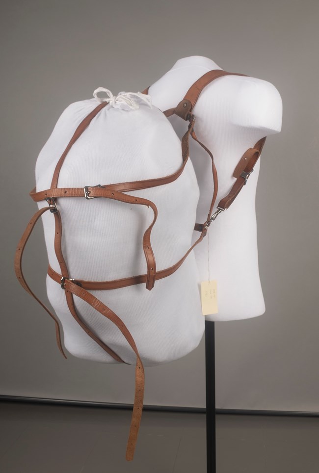 Leather pack harness modeled on a mannequin torso