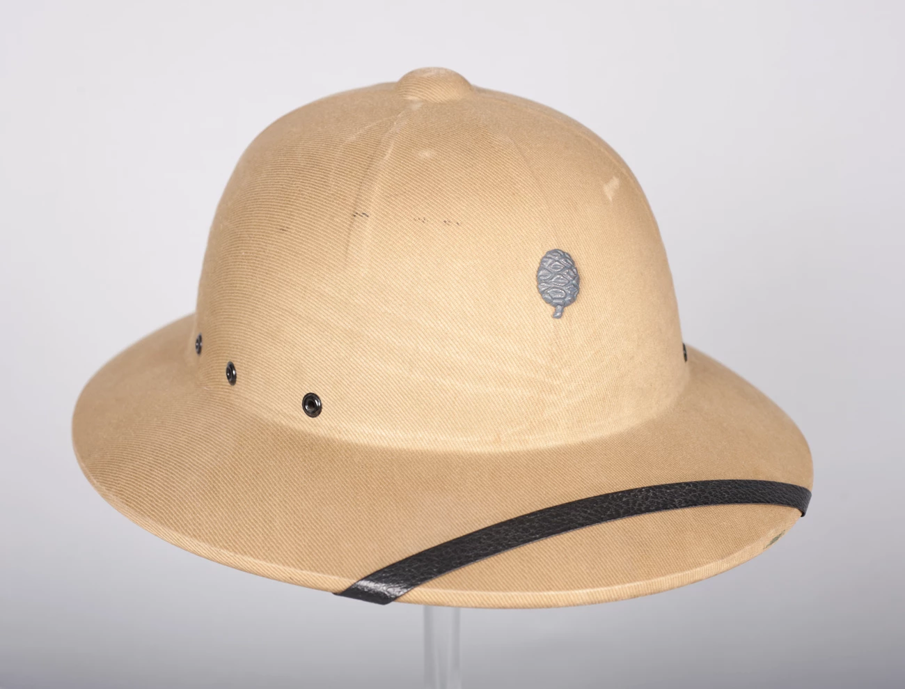 Sun Helmet Tan pith helmet with a silver Sequoia cone on the front