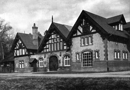 Vanderbilt Coach House A Queen Anne-style building of three bays constructed in brick and stucco.