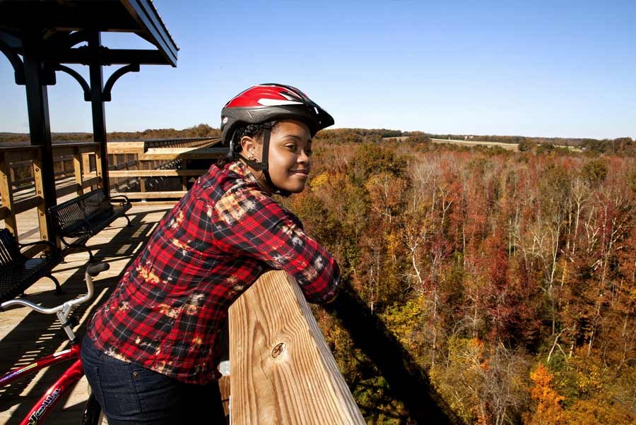 high bridge A bicyclist takes a break to take in the spectacular view on High Bridge Trail State Park.