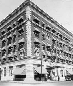 historic image of a commercial building with awnings