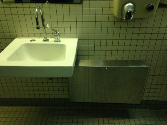 hotwaterheaters a sink on the left and hand dryer on the right
