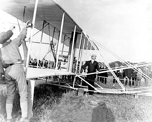 1908 Wright Brothers test flight Men readying a bi-wing airplane