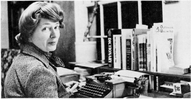 Dorothy Huyck sitting at her typewritter