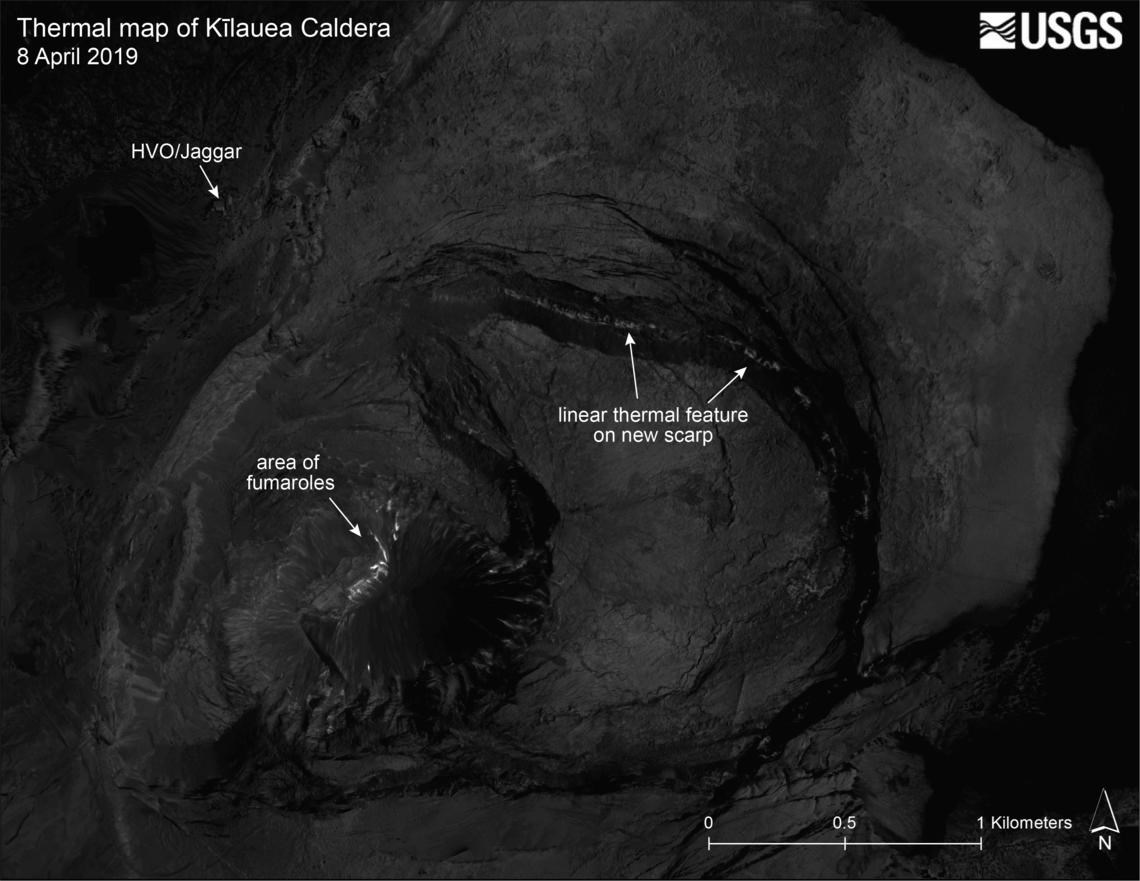 dark map image of a caldera small light areas show where heat from volcanic activity is detected