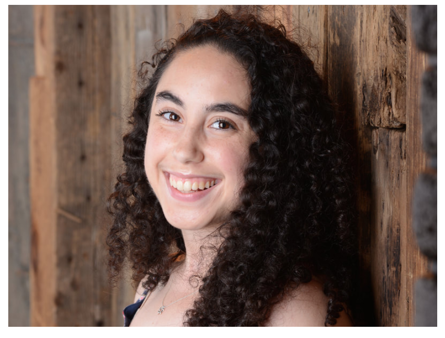 Jeri Stoller Smiling woman with dark curly hair.