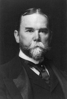 john hay 1 man with a suit jacket, tie and vest- the man has a beard that is starting to get white