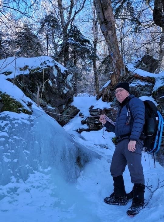 Dave hiking to Kaaterskill High Peak in 2022. Dave hiking in ice and snow