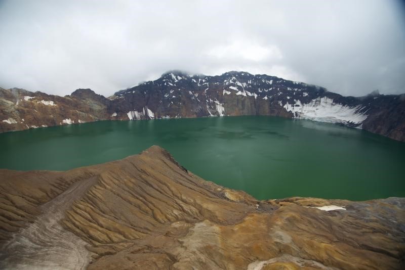 photo of a caldera with a crater lake