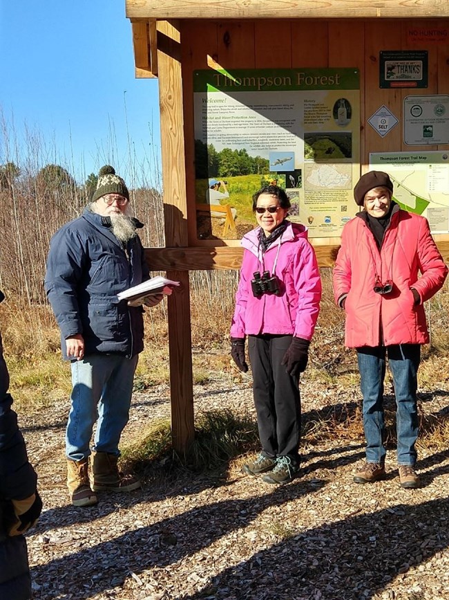 Dick Lord (left) talks with participants at the panel unveiling. LRAC funded the kiosk and the panel. Photo by RC Grimsley