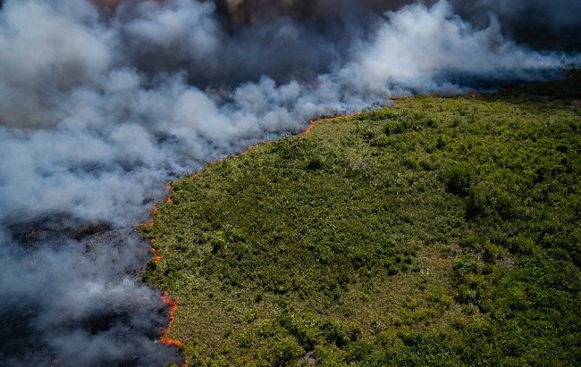 Fire burns and smoke billows across south Florida landscape