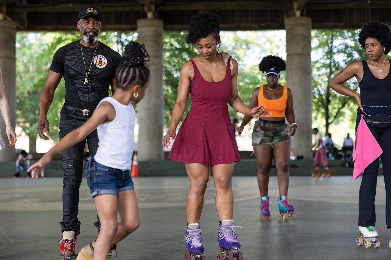 Kenneth ”Rollo” Davis, left, shows off his moves as he dances to music played by DJs alongside a group of roller skaters at Anacostia Park Skating Pavilion Kenneth ”Rollo” Davis, left, shows off his moves as he dances to music played by DJs alongside a group of roller skaters at Anacostia Park Skating Pavilion in Washington, D.C., on June 28, 2025