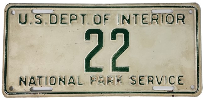 White and green National Park Service license plate "22"