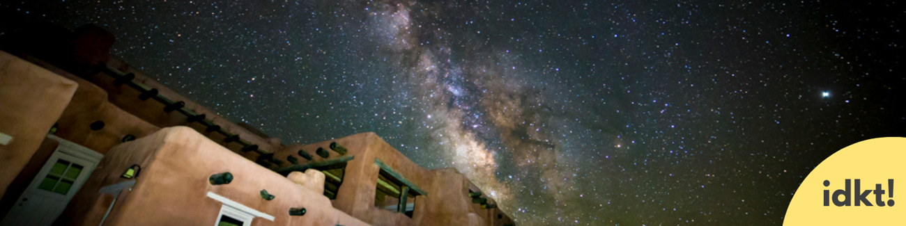 Light Pollution a building under a brilliant night sky with the milky way visible