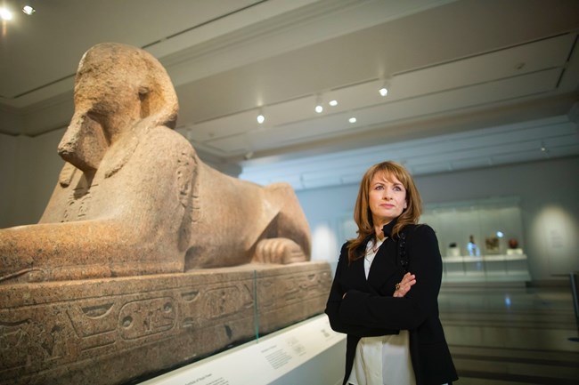 Lynn Meskell, PIK Professor, University of Pennsylvania beside a sphinx exhibit. Lynn Meskell, PIK Professor, University of Pennsylvania beside a sphinx exhibit.