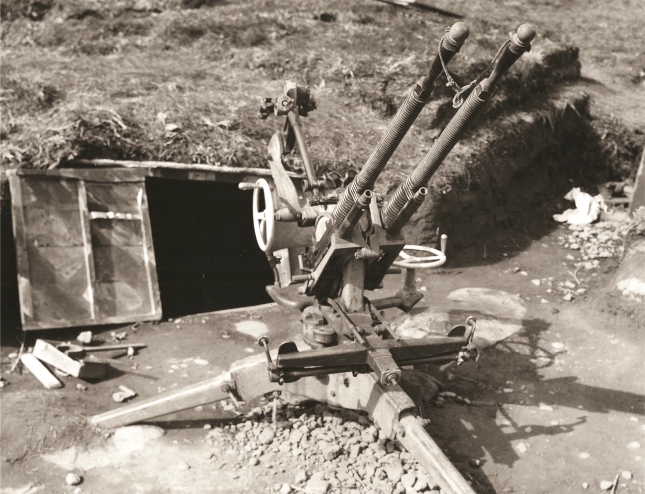 13.2mm Anti-Aircraft Gun on Kiska Black and white photo of twin-mounted anti-aircraft gun.
