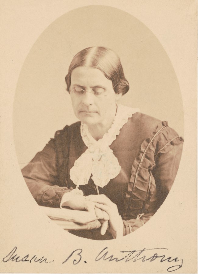 Susan B. Anthony, 1870 Portrait of an older woman wearing a 19th century dress and glasses