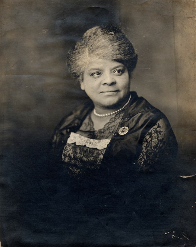 Ida B. Wells-Barnett, 1917 Black woman wearing a lace dress and a pearl necklace