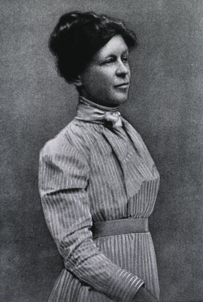 Lavinia Dock, ca.1900 White woman wearing a striped dress