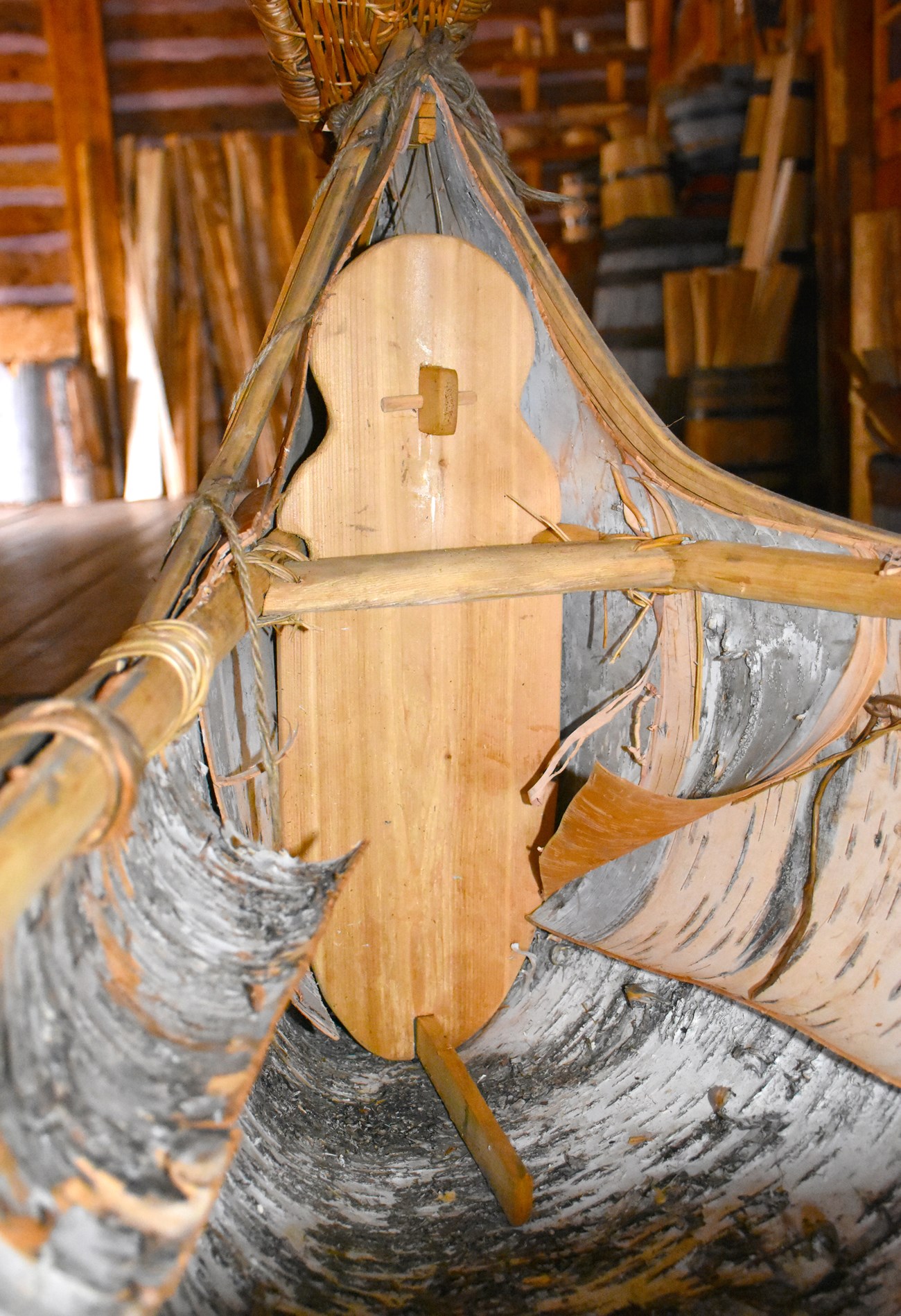 man board inside A shaped board in the inner end of a birch bark canoe.