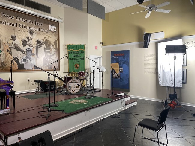 manuel santos JAZZ 2 midsize stage with instruments like drums, plus lighting, sound and camera equipment