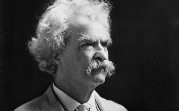 Mark Twain has a white mustache and is looking to the right