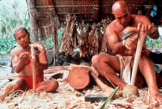 Preparing Stone Adz Two men in traditional clothing prepare ko'i (stone adz).