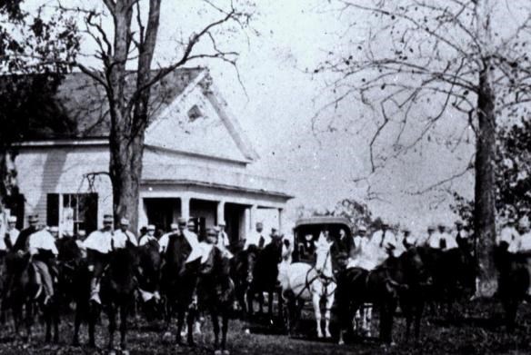 a black and white photo showing a group of men on election day 1880