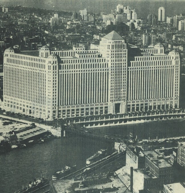 Merchandise Mart Huge eight story building with a tower sited on the edge of a river