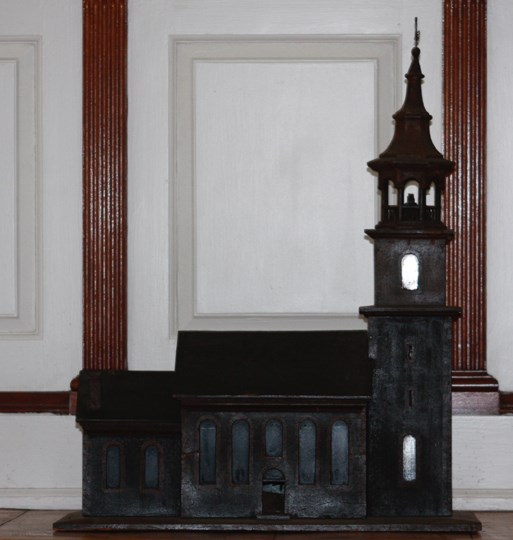 Small wooden model of a church, with steeple