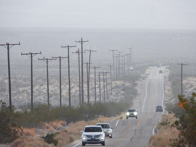 lt= cars along Kelbaker Road during a rainstorm