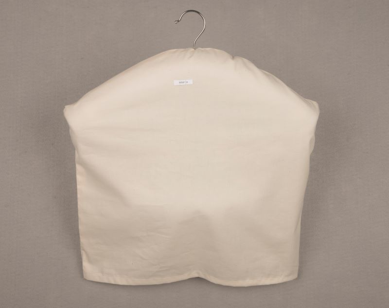Padded hanger with a longer outer slipcover made of muslin.