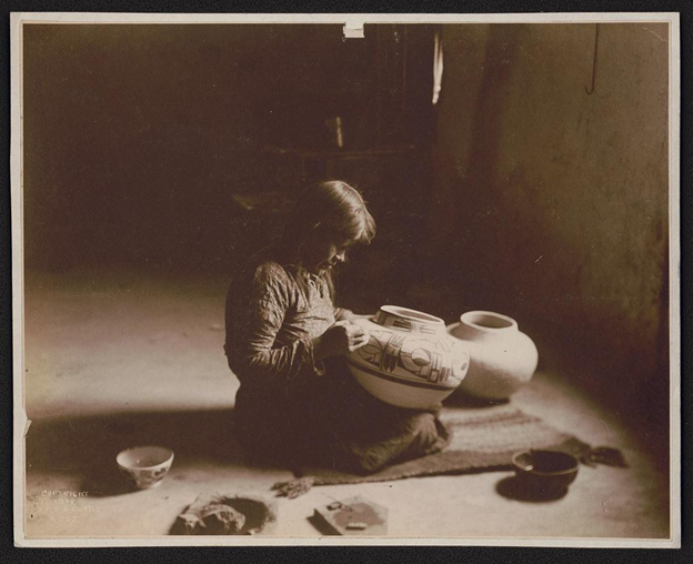 Nampeyo working on pottery inside