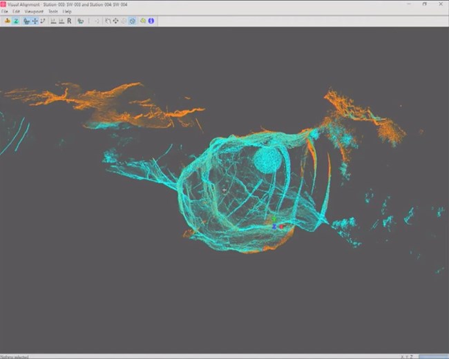 An iterative best-fit was applied between each scan, robust with no movement. A blue and orange mesh framework of part of the cave system displayed in 3D.