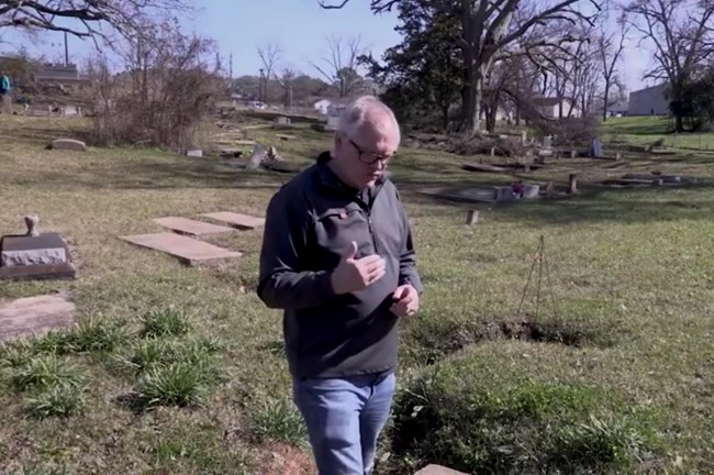 Simeon Warren outlines cemetery safety issues with drainage.