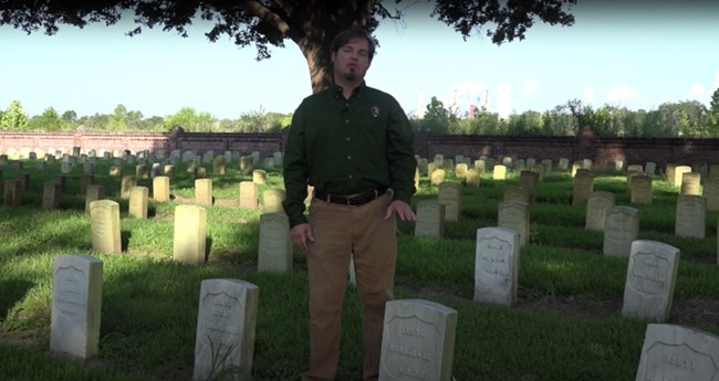 Jason Church, Chief of Technical Services, presenting work at Chalmette National Cemetery.