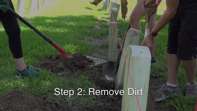 When moving dirt be careful not to touch the stone with the shovel at any time as this will cause damage to the fragile stone. Also it is a good idea to place a tarp or piece of plywood down to put the dirt on.