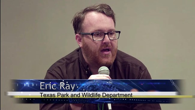 Video still of the speaker Eric Ray describing his department's role and the work they do.