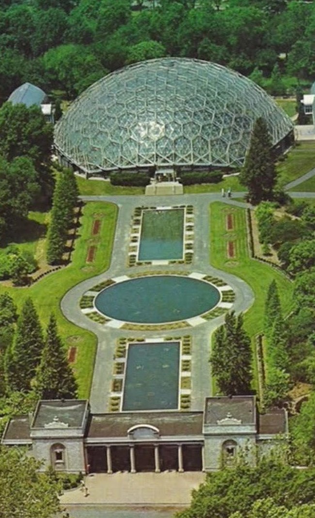 An overhead view of the geodesic dome dominating the landscape of the Missouri Botanical Garden.