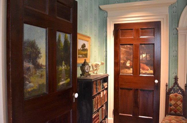 Two doors with painted panels in a parlor of the Griswold house.