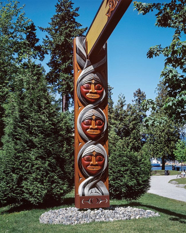 Part of Susan Point's work "People Among the People" in Stanley Park, Vancouver, BC. This is the Grandparents house post in the piece "Grandparents and Grandchildren."