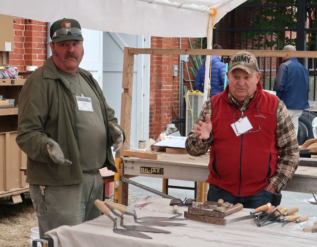 Dale Lupton and Dom teaching a class on masonry tools at a IPTW conference in Frederick, MD.