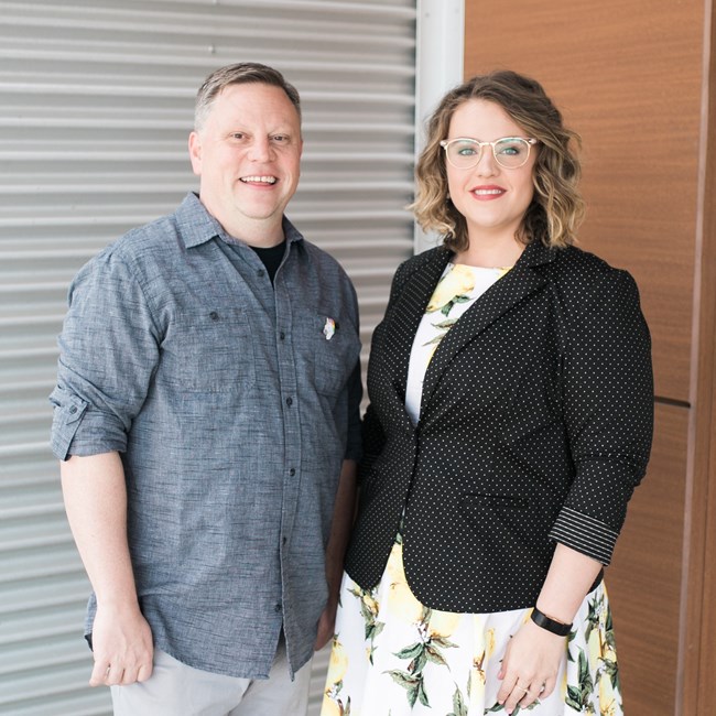 Josh Burford and Maigen Sullivan, co-founders of the Invisible Histories Project. Josh Burford and Maigen Sullivan stand on a porch together.