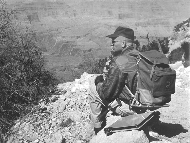 Neil Armstrong sits on the rim of the Grand Canyon Neil Armstrong sits on the rim of the Grand Canyon