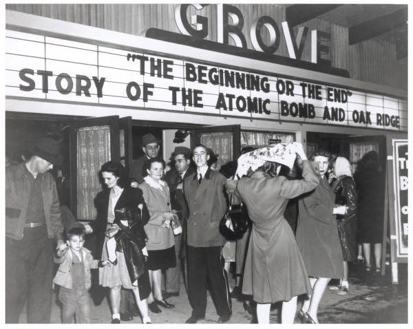 "The Beginning or the End" - Story of the Atomic Bomb and Oak Ridge A group of people in front of a movie theater. A man in an usher uniform is in center.